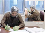 صوابی میں شاپنگ بیگ پہنے ڈاکٹر کا مریض چیک کرتے انوکھا احتجاج