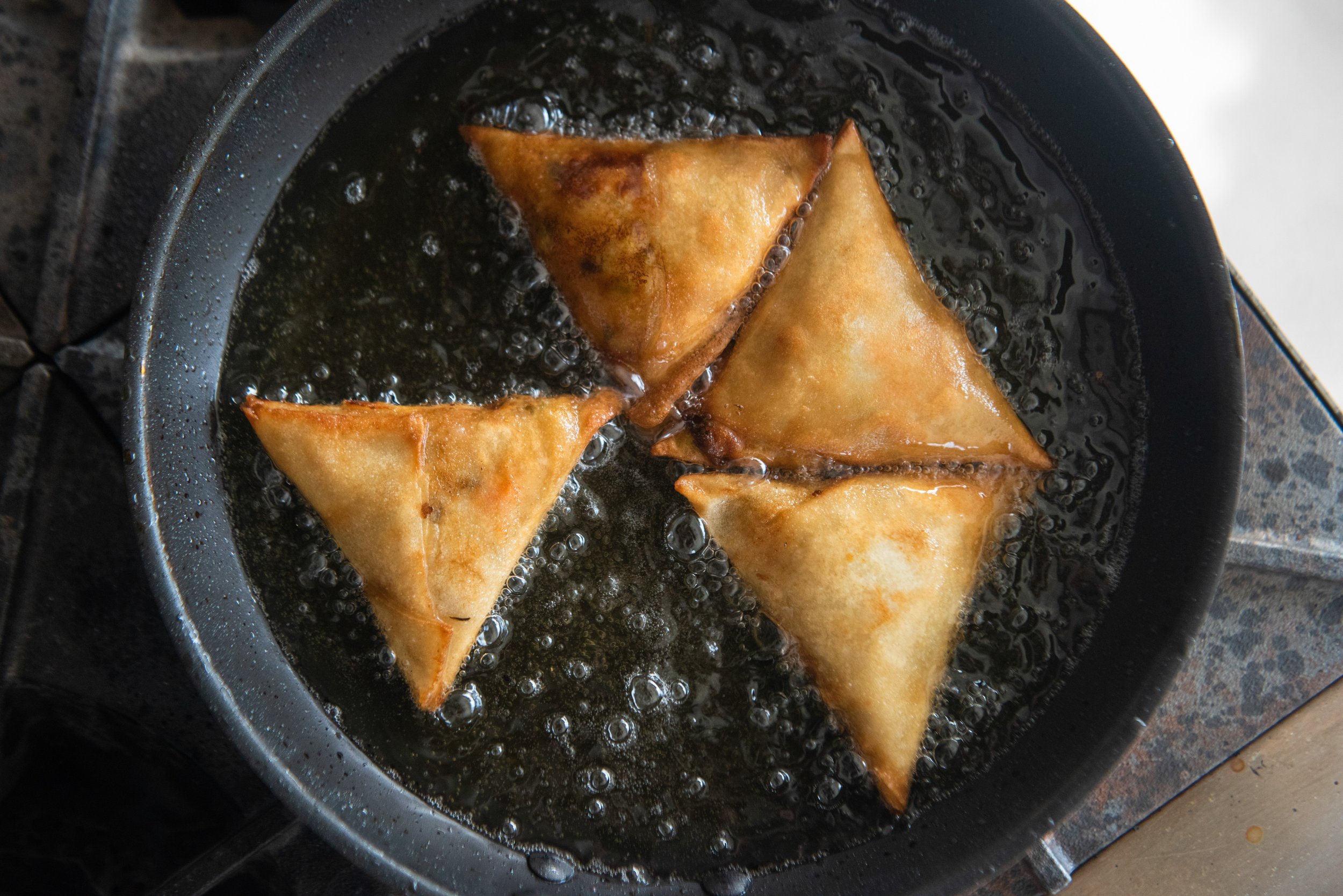 vegan samosa: potato, pea, carrot, date, raisins, tamarind date chutney, and hot sauce